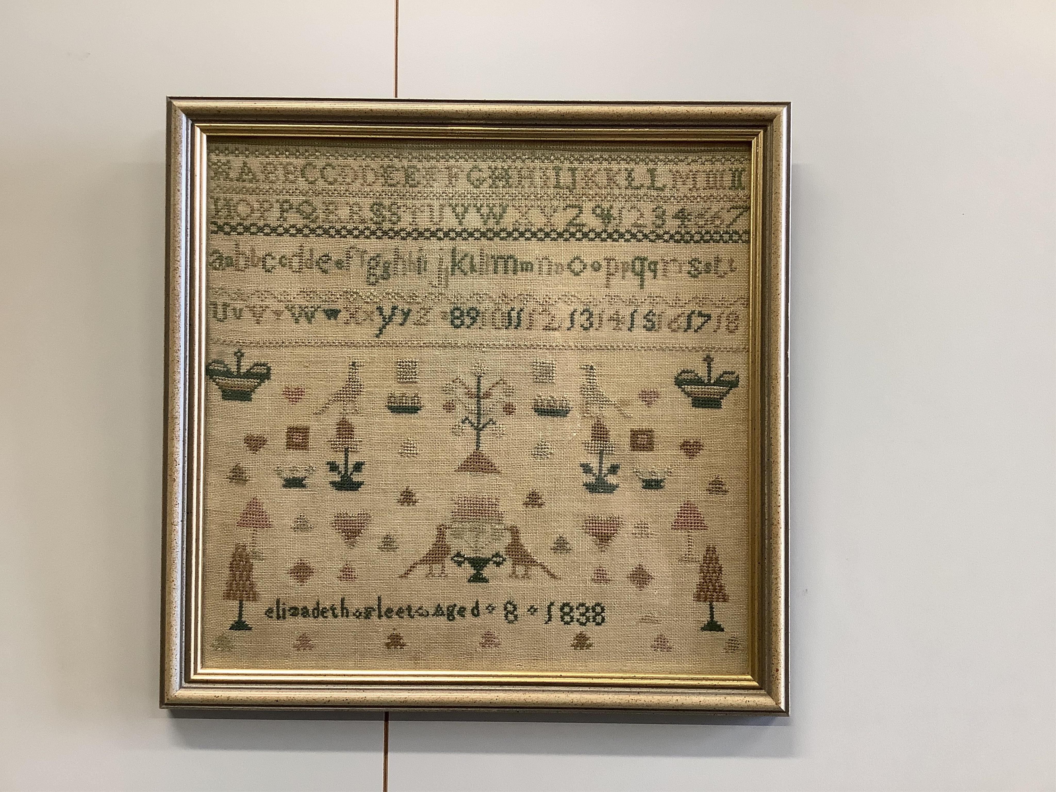 An early 19th century sampler dated 07, by Sarah Baker, ‘Henry IV’s Soliloquy of Sleep’, together with a later smaller alphabet and spot motif sampler by Elizabeth Fleet aged 8, dated 1838, both framed